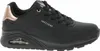 A black Skechers women's sports shoe with rose gold accents is shown from the side against a white background. Voir les images du produit