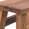 A close-up view of a wooden stool's corner and legs. Náhled obrázku produktu