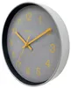 A close-up, angled view of a wall clock with a gray face and yellow numbers and hands. Produktbild-Vorschau