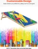 A cornhole board with a colorful abstract design, shown from a diagonal angle, with paint brushes and colorful paint splatters in the background. Náhled obrázku produktu