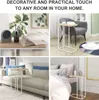 Collage of four images showing a side table in different home settings: on a desk with a book and clock, next to an armchair, beside a sofa, and near a bed. Produktbild-Vorschau