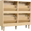 A light oak shoe cabinet with four flip-down drawers is shown against a white background. Podgląd zdjęcia produktu