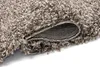 A close-up view of a rolled-up shaggy rug, showing the texture of the fibers and the backing. Anteprima dell’immagine prodotto