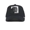 A black trucker cap with a panther patch on the front. Produktbild-Vorschau