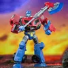 A Transformers action figure, Optimus Prime, holding an axe, standing in a dynamic pose against a colorful, abstract background. Anteprima dell’immagine prodotto