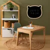 A child's play area with a bookshelf, table, and chair. Anteprima dell’immagine prodotto