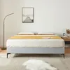 A bed with bedding in a room. Produktbild-Vorschau