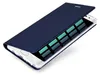 A dark blue flip case for a smartphone is shown open, revealing the phone's screen which displays a grid of green rectangles. Produktbild-Vorschau