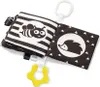 A black and white fabric book for babies with attached teething toy. Produktbild-Vorschau
