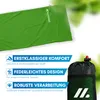 A green sleeping bag is shown laid out, with marketing text and icons below it, and a black storage bag with a red drawstring closure to the right. Produktbild-Vorschau