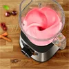 A close-up view of a stand mixer with pink batter being blended, set on a wooden surface with some ingredients in the background. Anteprima dell’immagine prodotto