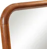 A close-up view of the corner of a wooden mirror frame. Voir les images du produit
