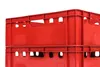 Two red plastic crates stacked on top of each other against a white background. Voir les images du produit