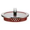 A close-up studio shot of a red and silver pot lid with a handle and holes for draining. Podgląd zdjęcia produktu