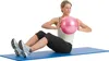 A woman is performing a core exercise on a yoga mat, holding a pink ball. Anteprima dell’immagine prodotto