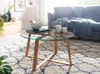 A living room scene with a coffee table, sofa, and rug. Náhľad obrázku produktu