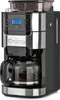 A close-up studio shot of a black and silver coffee maker with a glass carafe filled with coffee. Produktbild-Vorschau