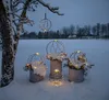 Decorative spheres with lights in a snowy outdoor setting at dusk. Produktbild-Vorschau