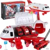 A toy transport airplane with several small fire trucks inside, displayed with its packaging and accessories. Produktbild-Vorschau