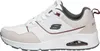 A side view of a white sneaker with gray and beige accents. Voir les images du produit