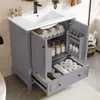 A bathroom vanity with a sink and faucet, showing storage compartments with towels, bottles, and toilet paper. Podgląd zdjęcia produktu