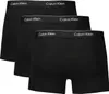 Three black Calvin Klein boxer shorts are stacked on a white background. Voir les images du produit
