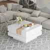 A modern living room with a sectional sofa and a white coffee table. Voir les images du produit