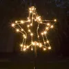 A lighted star decoration at night. Produktbild-Vorschau