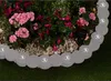 A garden border with integrated lights surrounding flowers and gravel. Produktbild-Vorschau