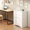 A modern white dresser with four drawers sits next to a wooden desk with a laptop and books. The room has a clock on the wall and two framed pictures. Anteprima dell’immagine prodotto