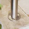 Close-up of a metal pole base attached to stone tiles. Produktbild-Vorschau