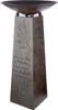 A decorative metal stand with a bowl on top, featuring engraved text and floral designs. Produktbild-Vorschau