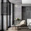 A modern living room setting with a pendant lamp, armchair, and side table. Anteprima dell’immagine prodotto