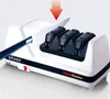 A knife sharpener with a knife being inserted into it. Produktbild-Vorschau