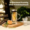 A glass pitcher filled with water and fruit slices, placed on a wooden board with a grapefruit half and rosemary sprigs, next to two glasses. Produktbild-Vorschau