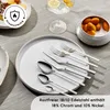 A table setting with cutlery and plates, along with a drink and kumquats. Produktbild-Vorschau