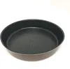 A close-up, angled view of a round baking pan on a white background. Voir les images du produit