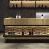 A bar counter with bottles displayed behind a mesh. Produktbild-Vorschau