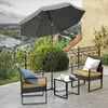 A patio set with chairs, a table, and an umbrella on a balcony overlooking a city. Produktbild-Vorschau