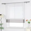 A white roman blind with a gray band at the bottom is shown hanging in a window. Produktbild-Vorschau