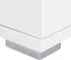 Close-up of the corner of a white cabinet with a silver base. Produktbild-Vorschau