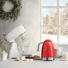 A kitchen scene with appliances and cookies in front of a window showing a snowy forest. Produktbild-Vorschau