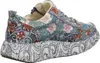 A side view of a colorful, floral-patterned sneaker with a thick, patterned sole. Produktbild-Vorschau