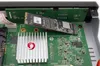 Close-up view of electronic components inside a device, showing circuit boards and an SSD. Náhled obrázku produktu
