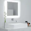 A modern bathroom sink area with a lit mirror, a vase with flowers, and toiletries. Produktbild-Vorschau