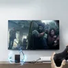 A person is playing a video game on a TV, with the Ugreen HDMI to VGA converter connected to a PlayStation console. Voir les images du produit