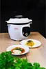 A white and black Tefal Cook4me+ smart multi-function pot is displayed on a wooden table, with two plates of food in front of it. Podgląd zdjęcia produktu