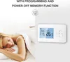 A woman sleeping in bed next to a smart thermostat mounted on a wall. Podgląd zdjęcia produktu