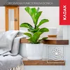 A white plant pot with a green plant sits on a wooden shelf, next to a draped blanket. Náhľad obrázku produktu