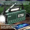 A green emergency radio with a flashlight and a phone charging from it. Produktbild-Vorschau